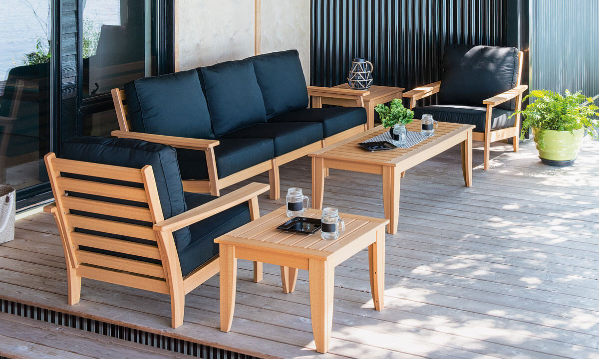 EC Woods Calistoga Outdoor Poly Furniture Set Shown in Natural Teak with Black Cushions