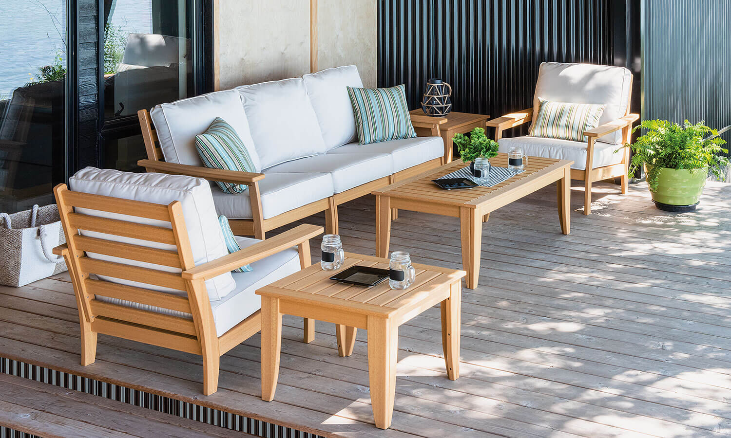 EC Woods Calistoga Outdoor Poly Furniture Set Shown in Natural Teak with Canvas Cushions