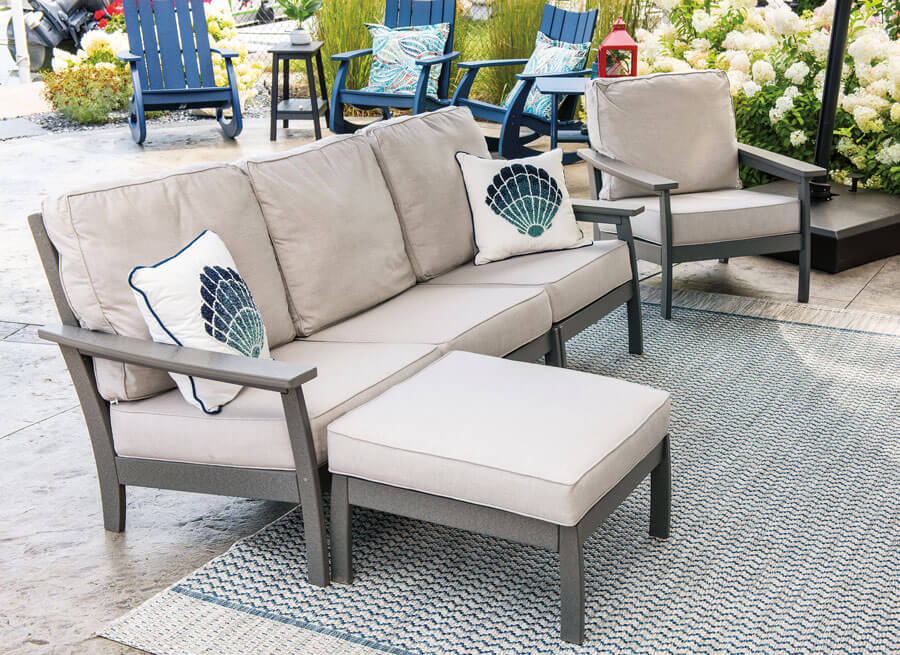 EC Woods Calistoga Outdoor Poly Sofa and Ottoman Shown in Dark Gray with Sunbrella Natural Cushions